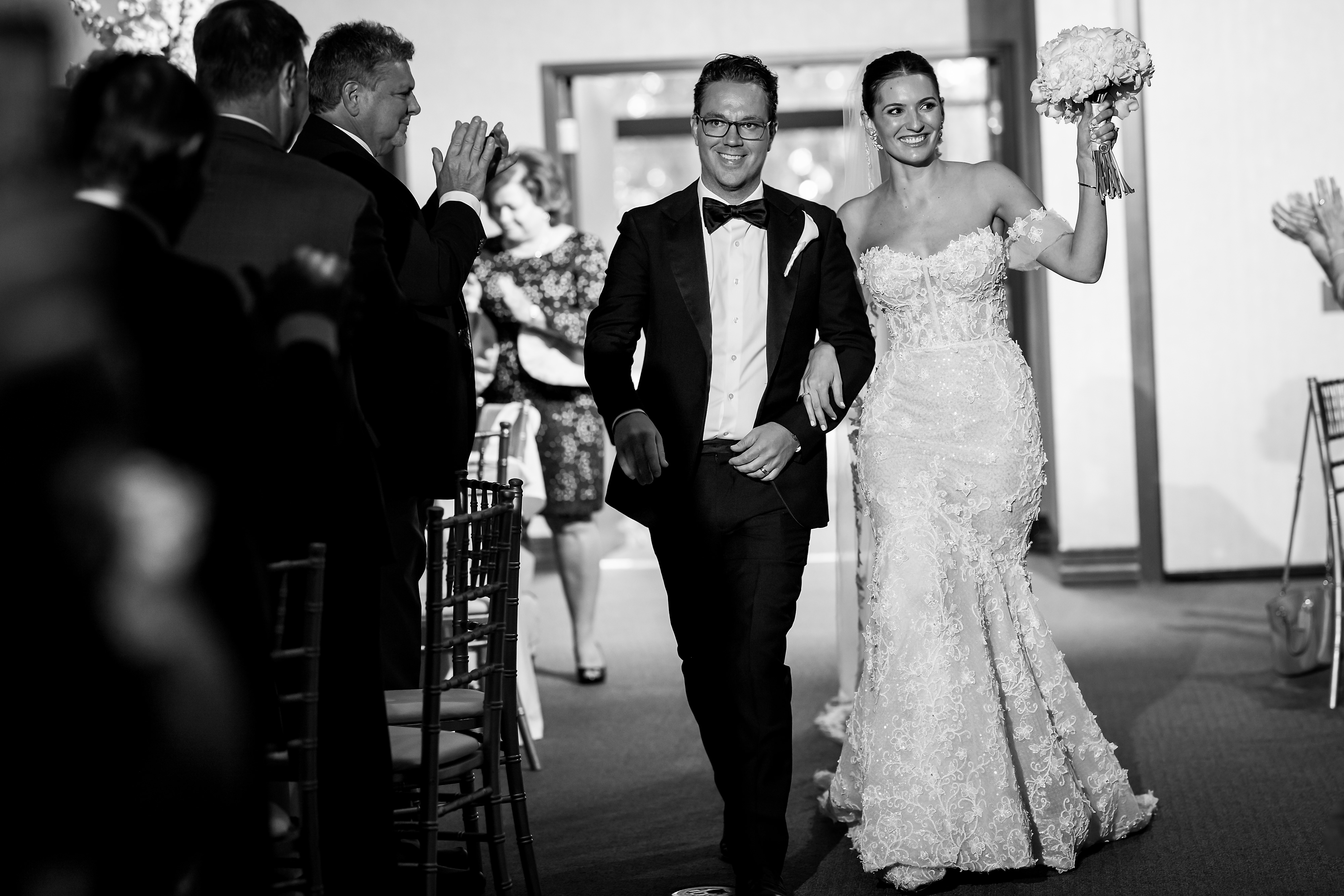 bride and groom walk into wedding reception at Halls of St. George in Schererville, Indiana