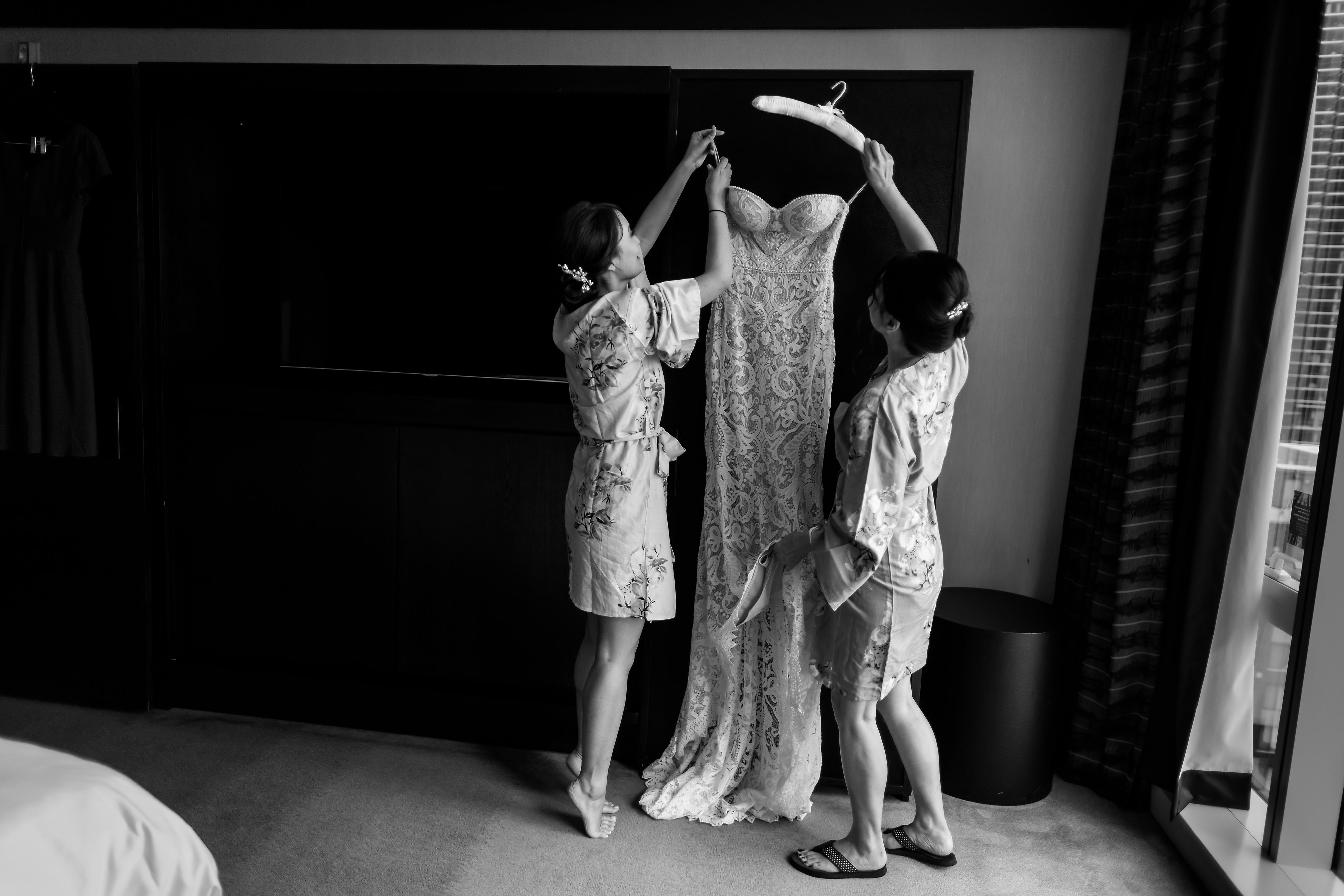 Bride and mother get the dress down while getting ready for her wedding at Loews Hotel in downtown Chicago