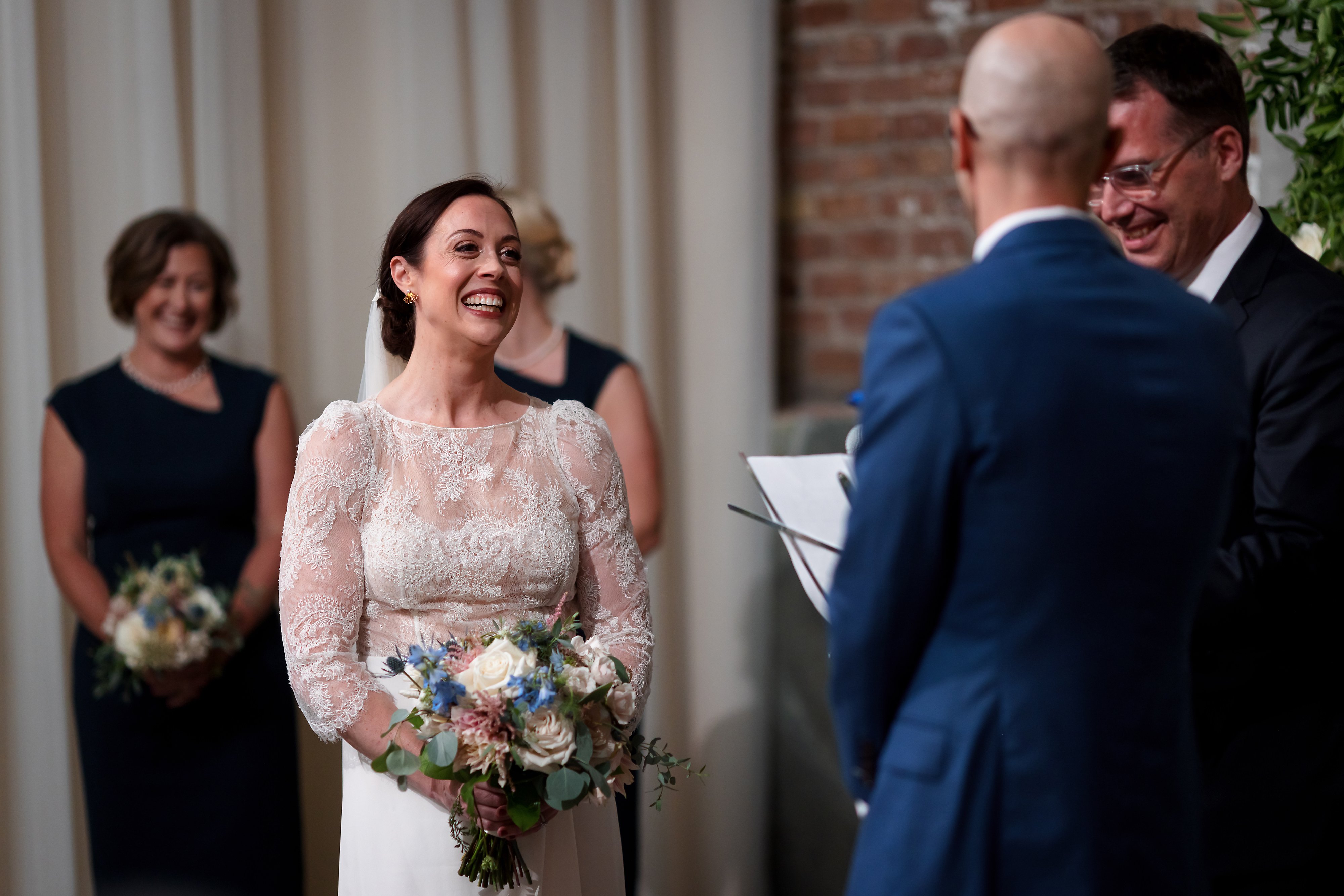Bride laughs during wedding ceremony at The Fairlie