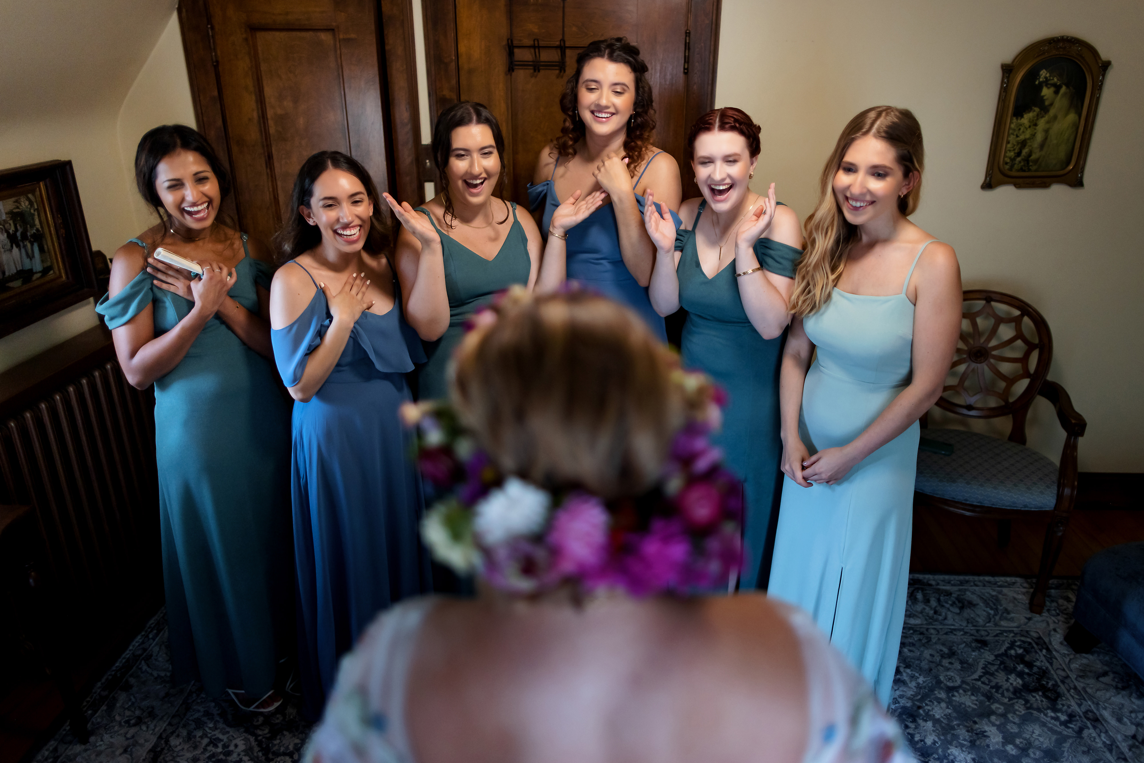 Bridesmaids react to seeing bride while getting ready for wedding at The Grove Redfield Estate in Glenview