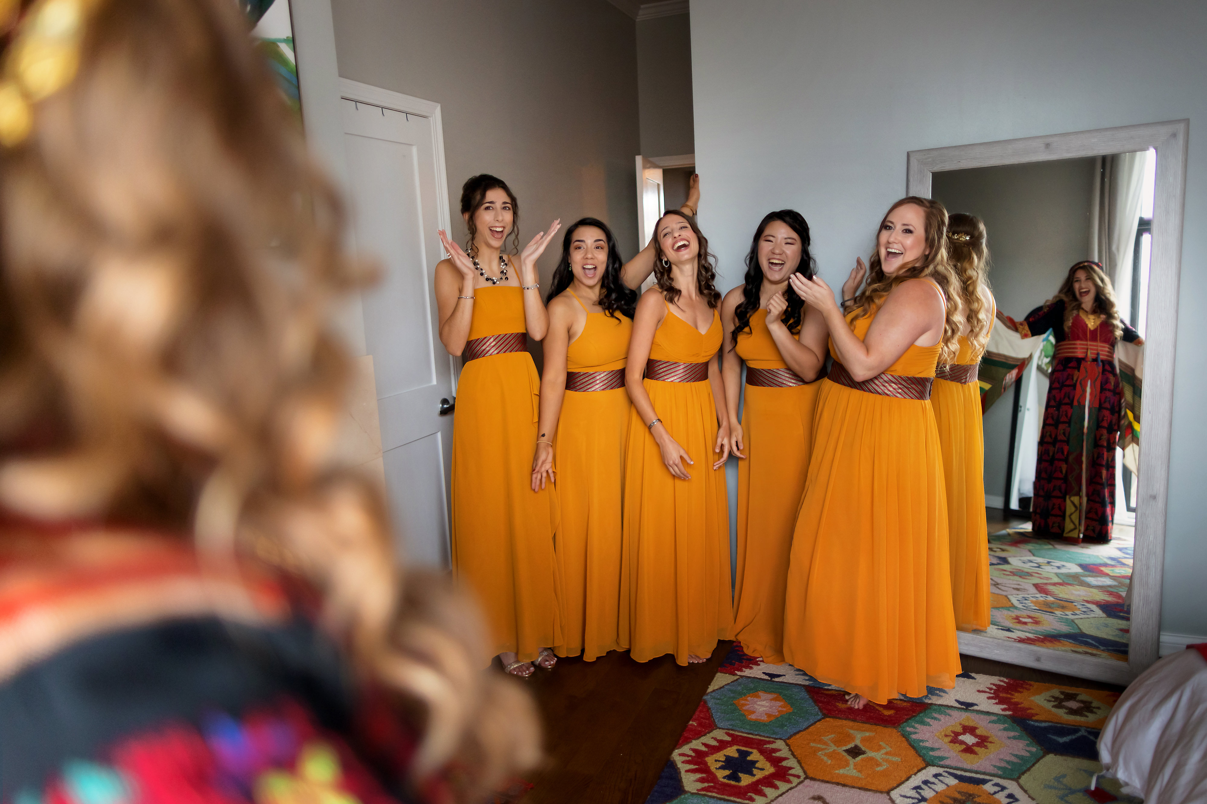 Bridesmaids react to seeing bride in traditional Palestinian wedding dress
