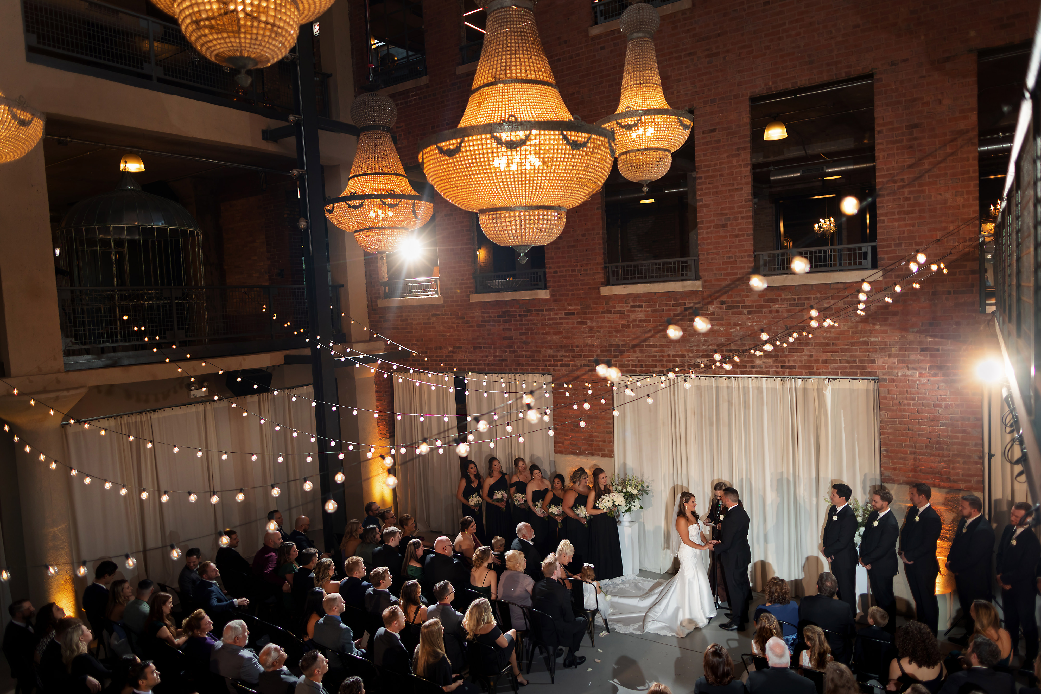 Wide angle view of North Atrium ceremony space during wedding ceremony at Artifact Events in Chicago's Ravenswood neighborhood.
