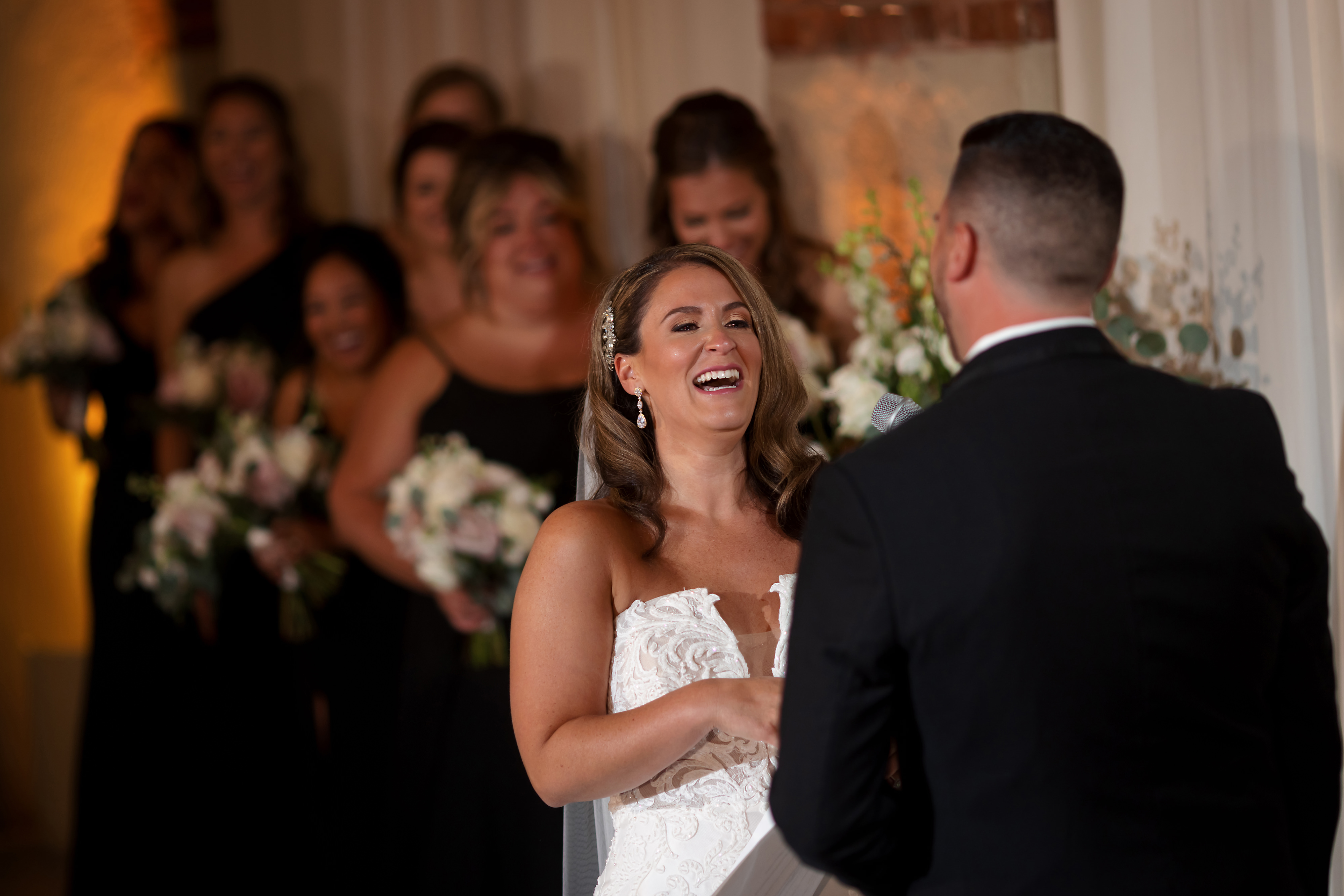 Bride laughs during wedding ceremony at Artifact Events in Chicago's Ravenswood neighborhood.