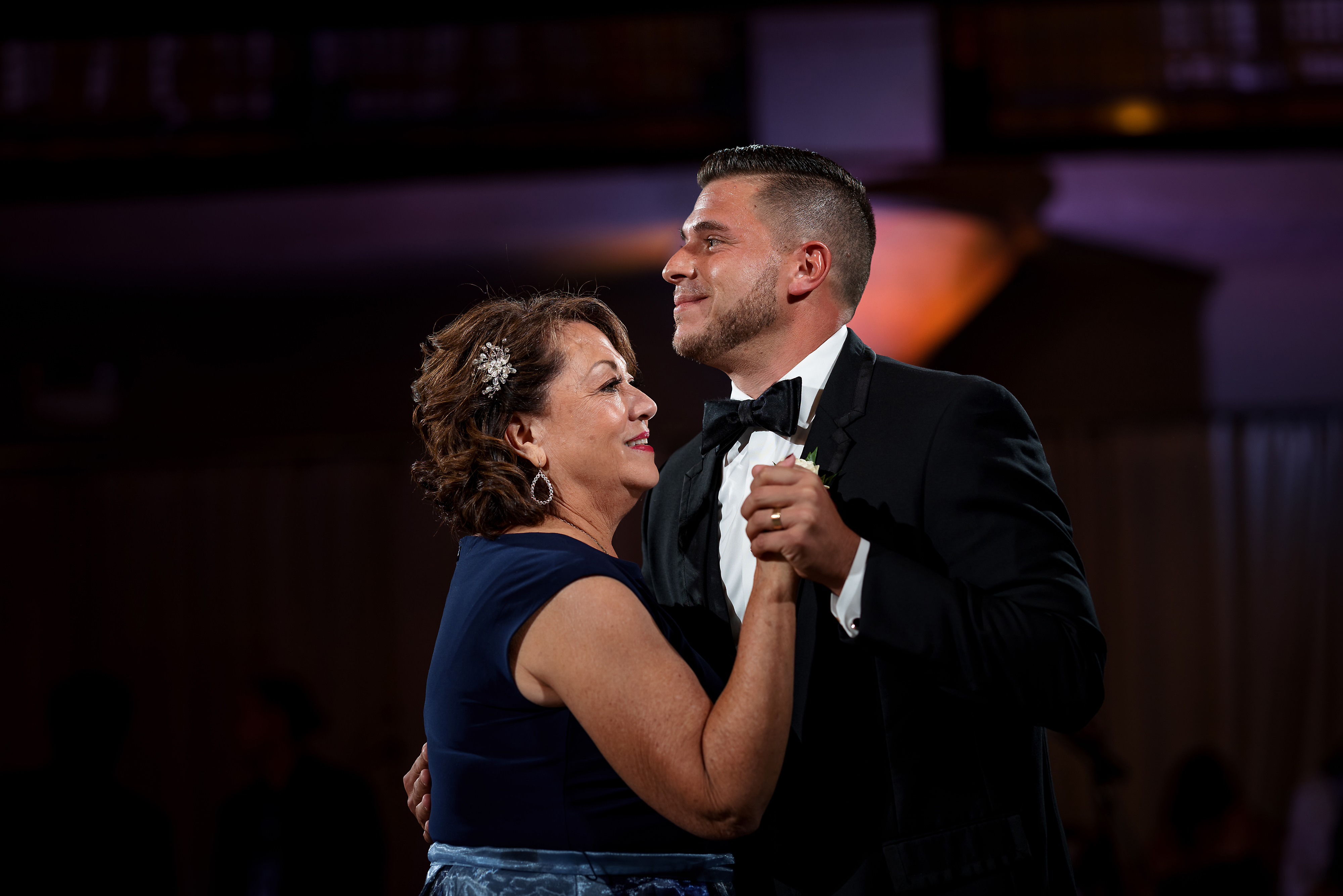 Groom dances with mom during wedding reception at Artifact Events in Chicago.