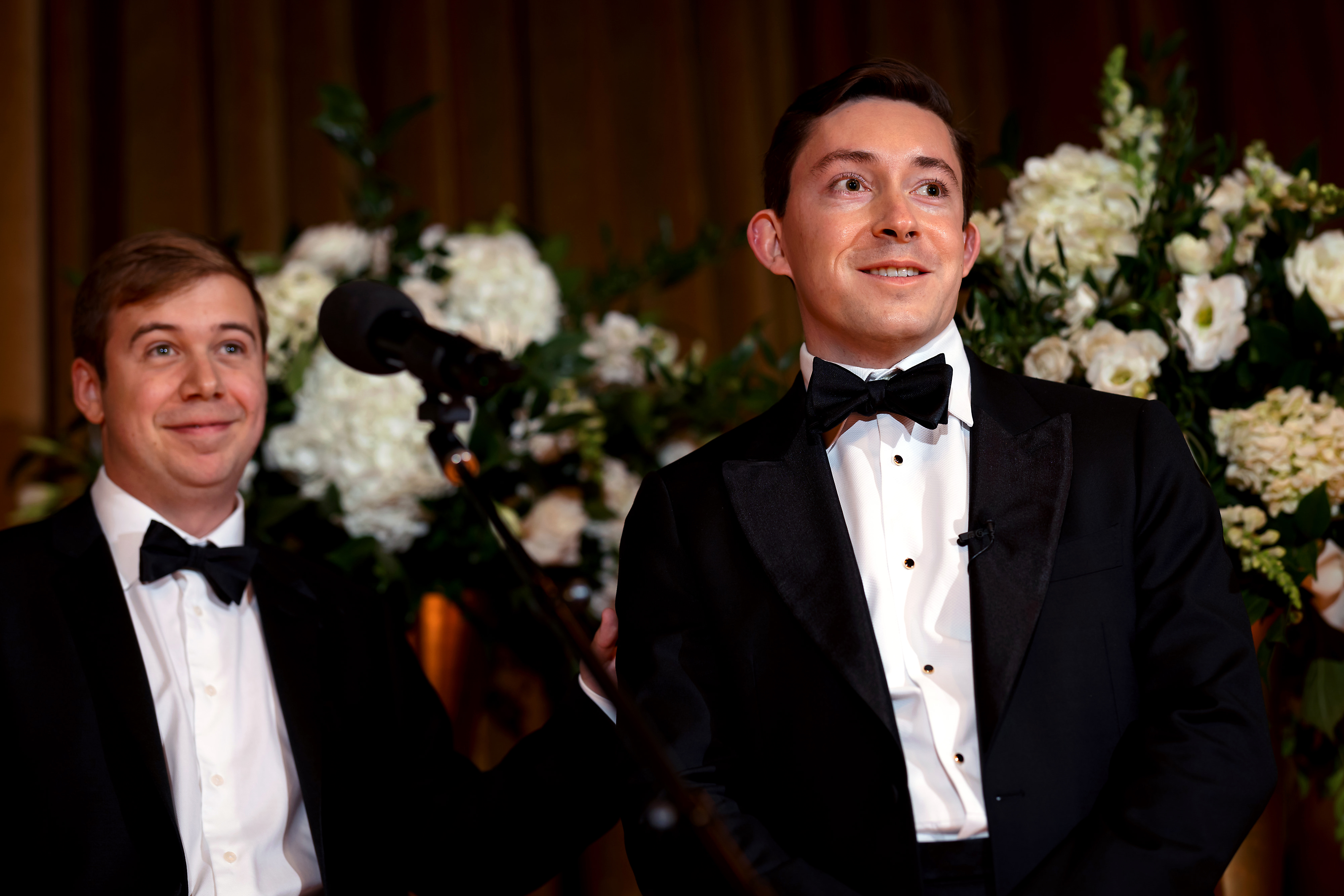 Groom reacts to seeing bride walk down the aisle during wedding ceremony at The Drake Hotel in Chicago