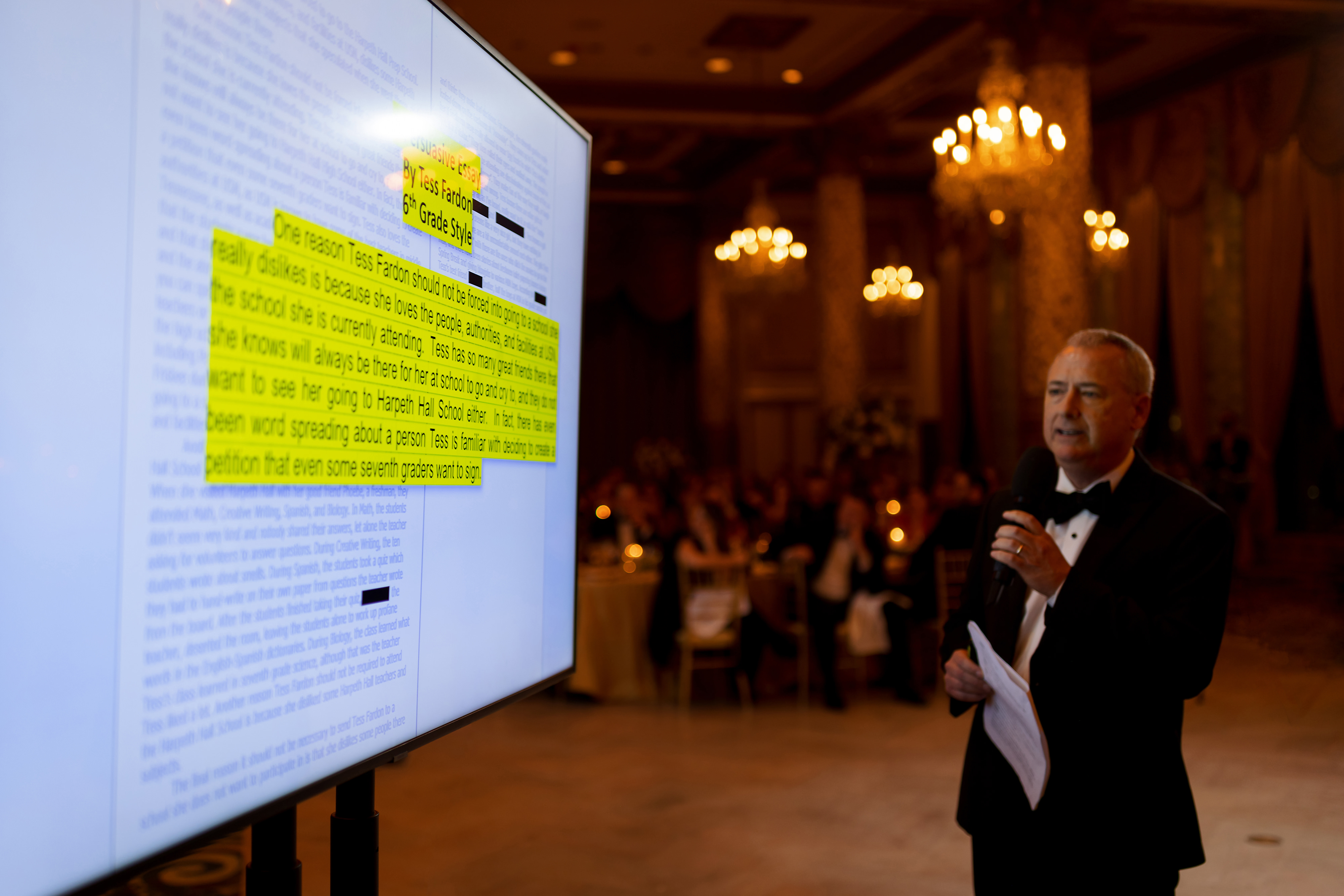 Father of the bride gives powerpoint presentation during toast at wedding reception in the Grand Ballroom at The Drake Hotel in Chicago