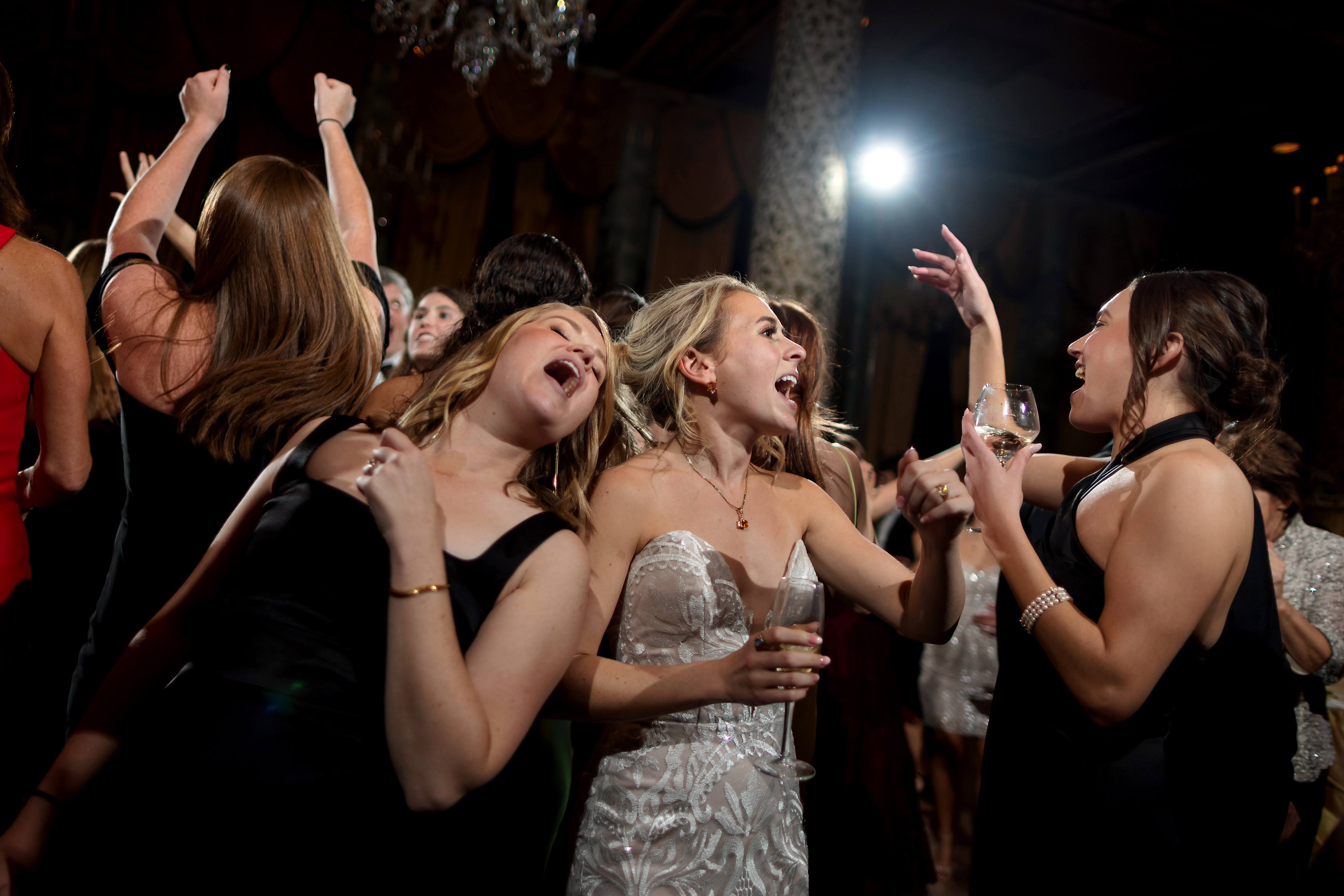 Wedding guests dance during wedding reception in the Grand Ballroom at The Drake Hotel in Chicago