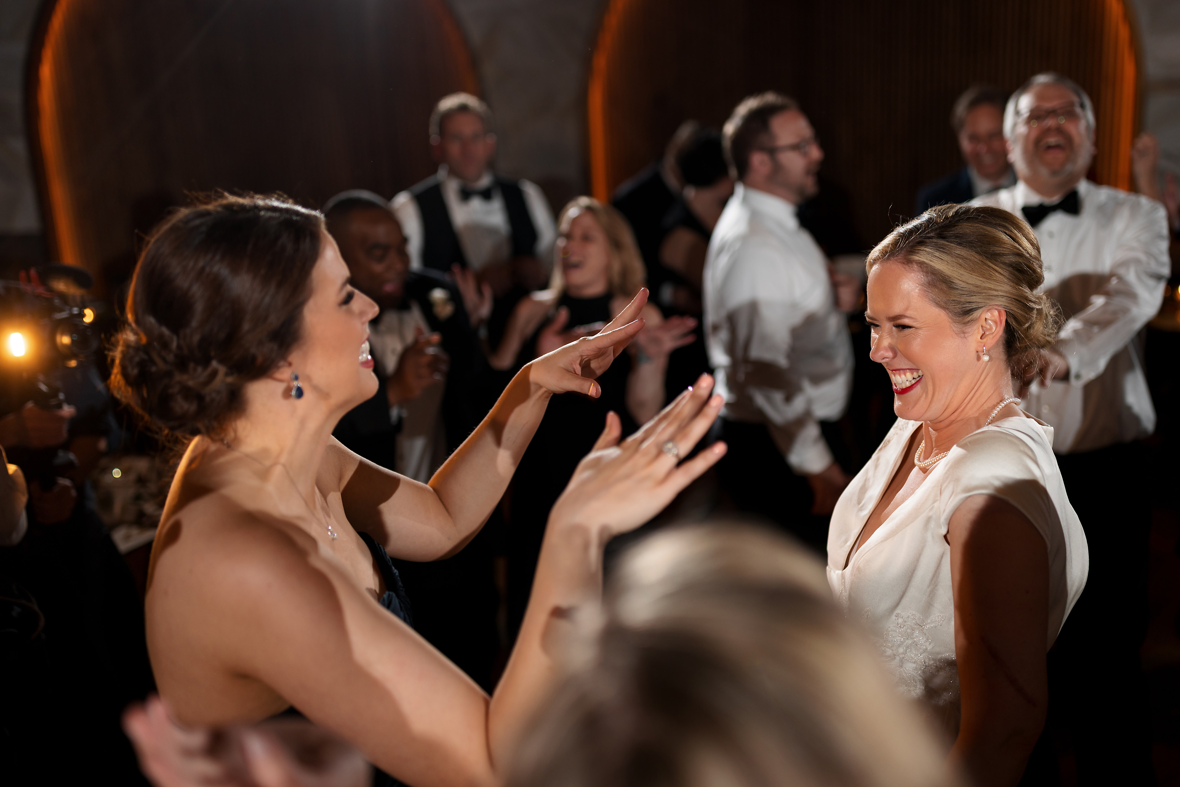 Bride and sister dance during wedding reception at Chicago Winery