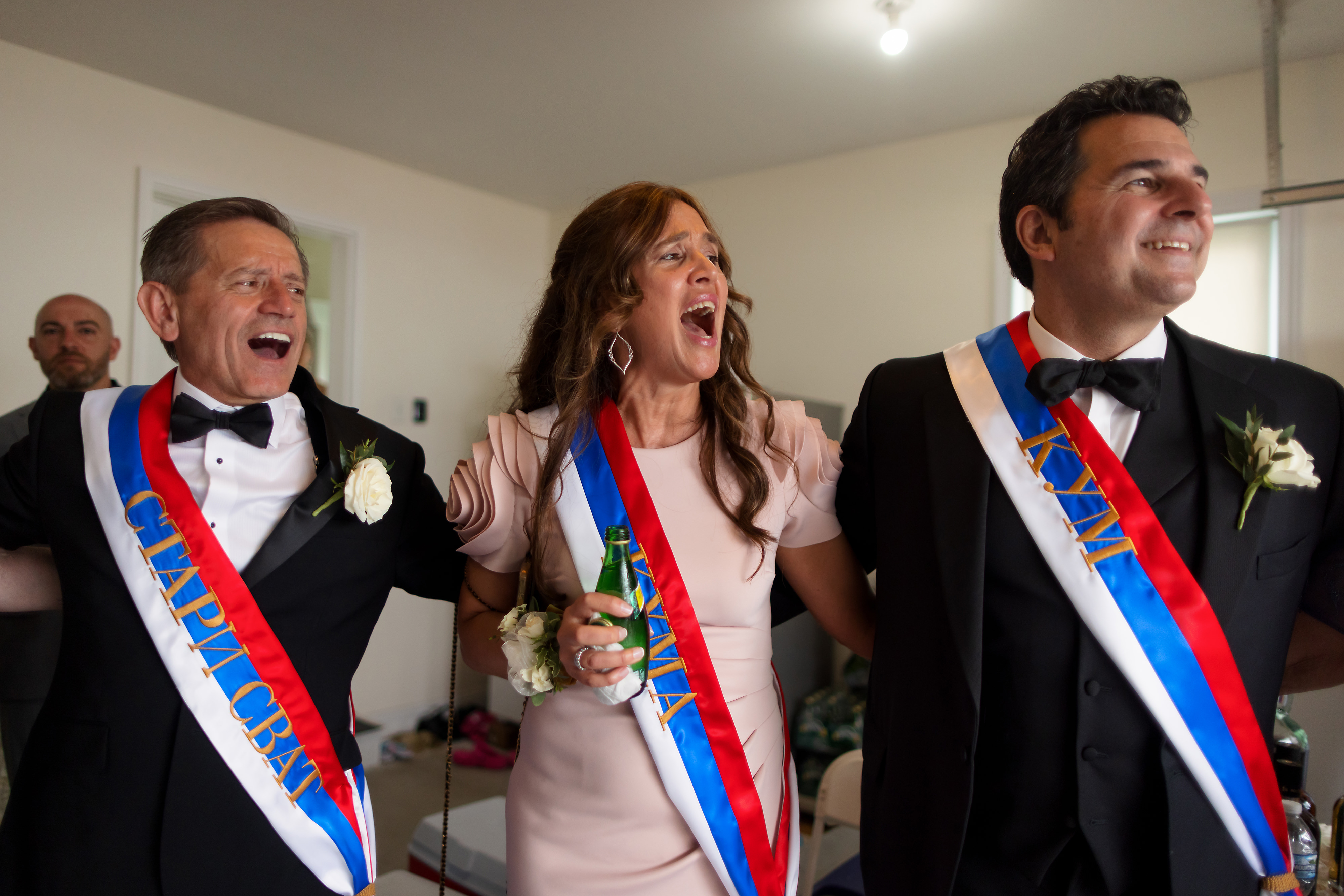 family celebrates during bride's skup before serbian orthodox wedding