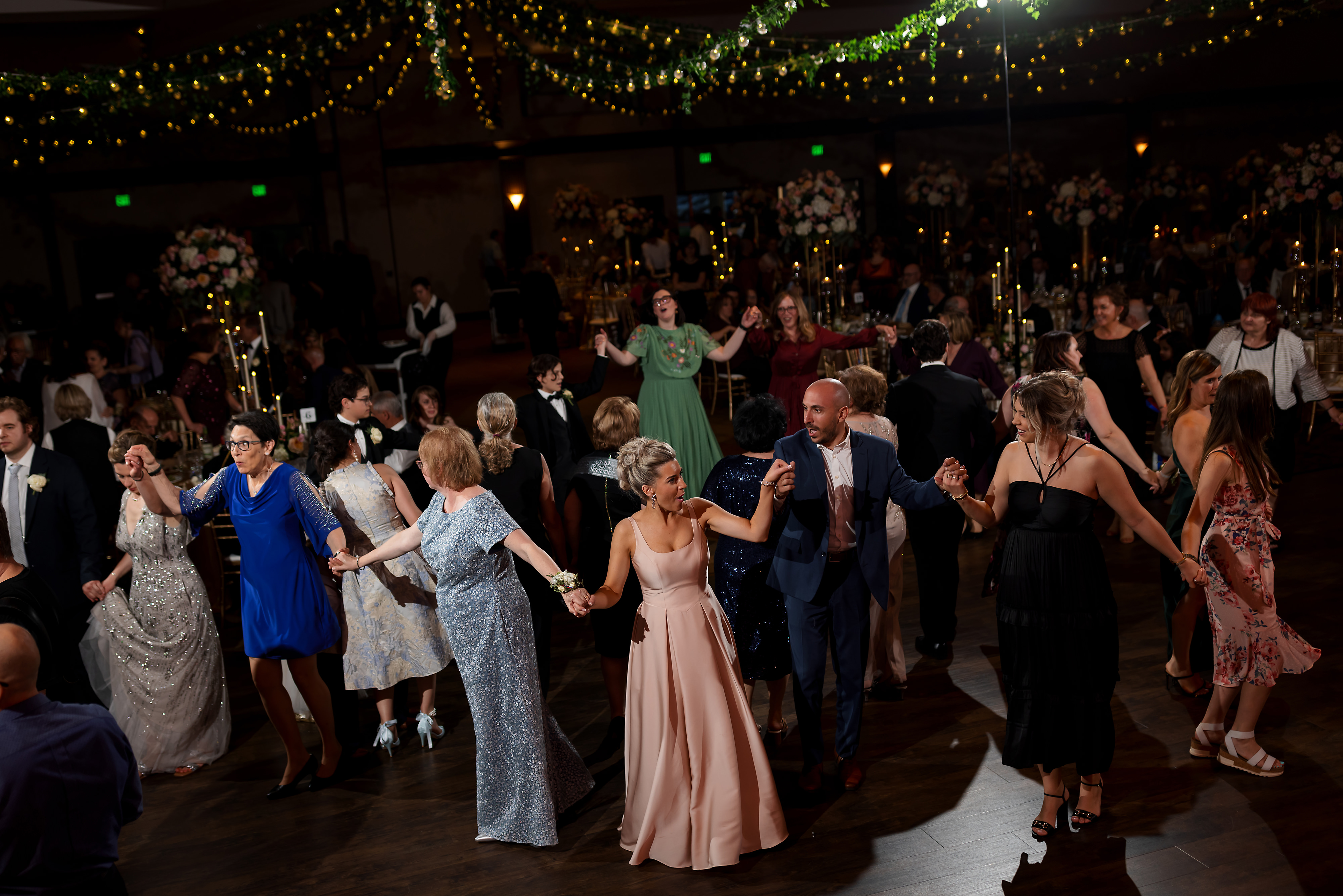 wedding guests dance during reception at Halls of St. George