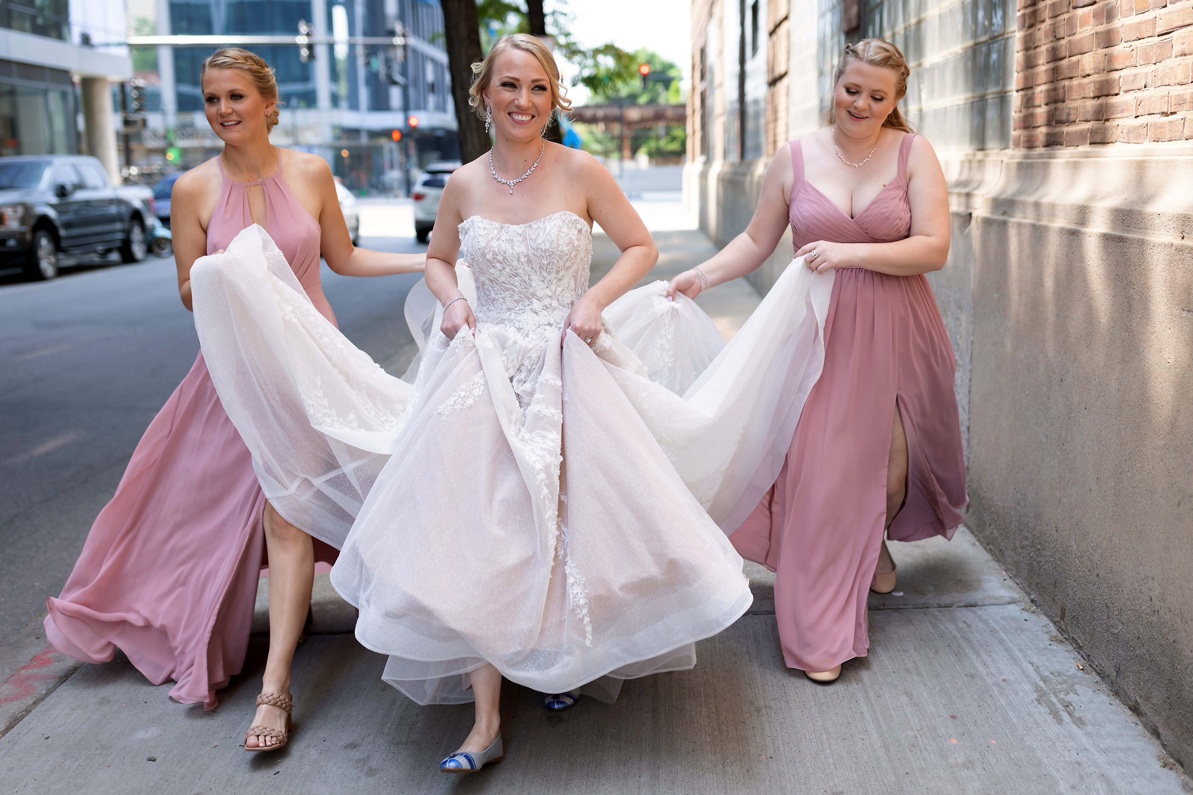 bride and bridesmaids walk down Chicago city street