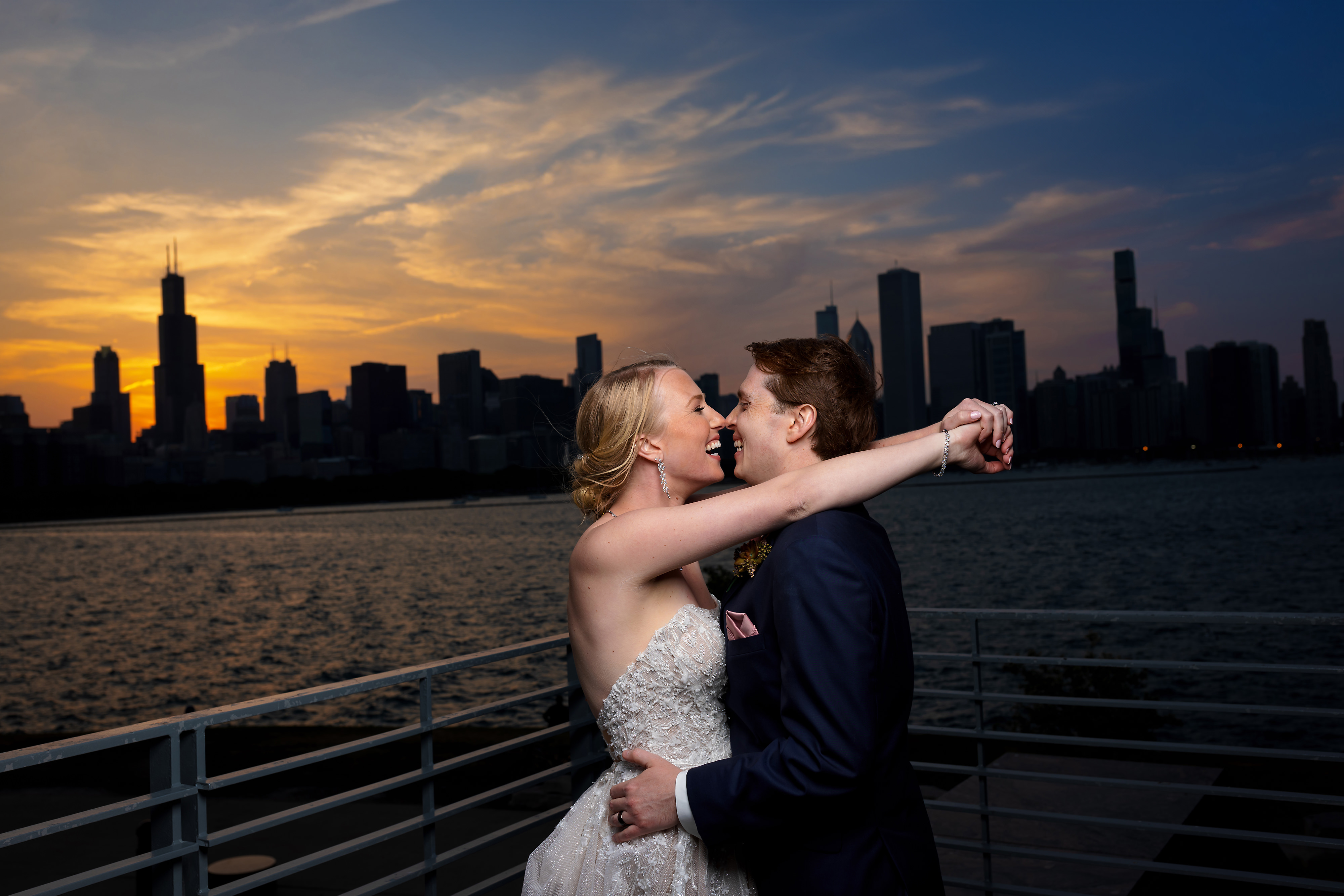 sunset portrait of bride and groom at Adler Planetarium in Chicago