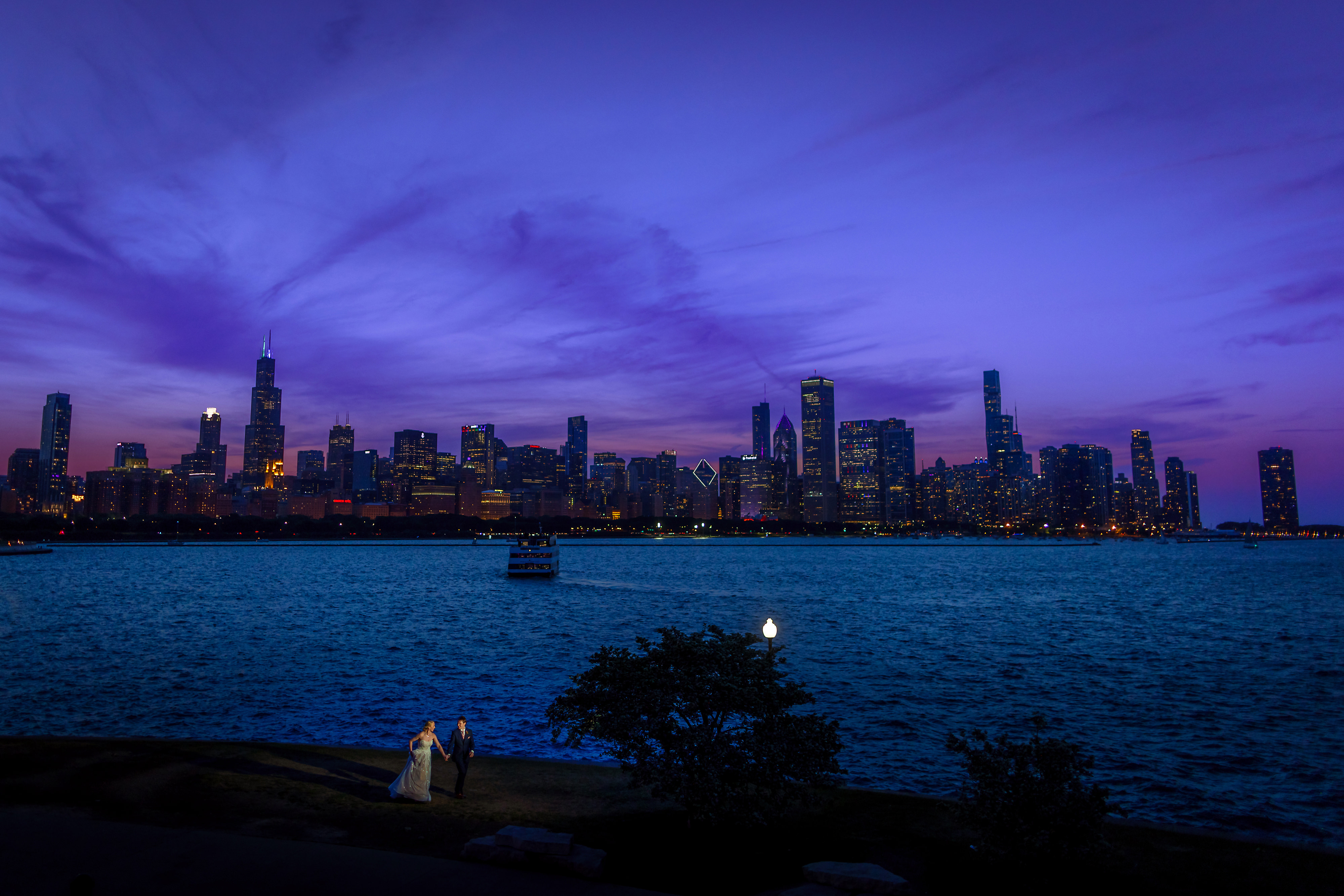 Bride and groom dusk blue hour portrait with Chicago city skyline in the background