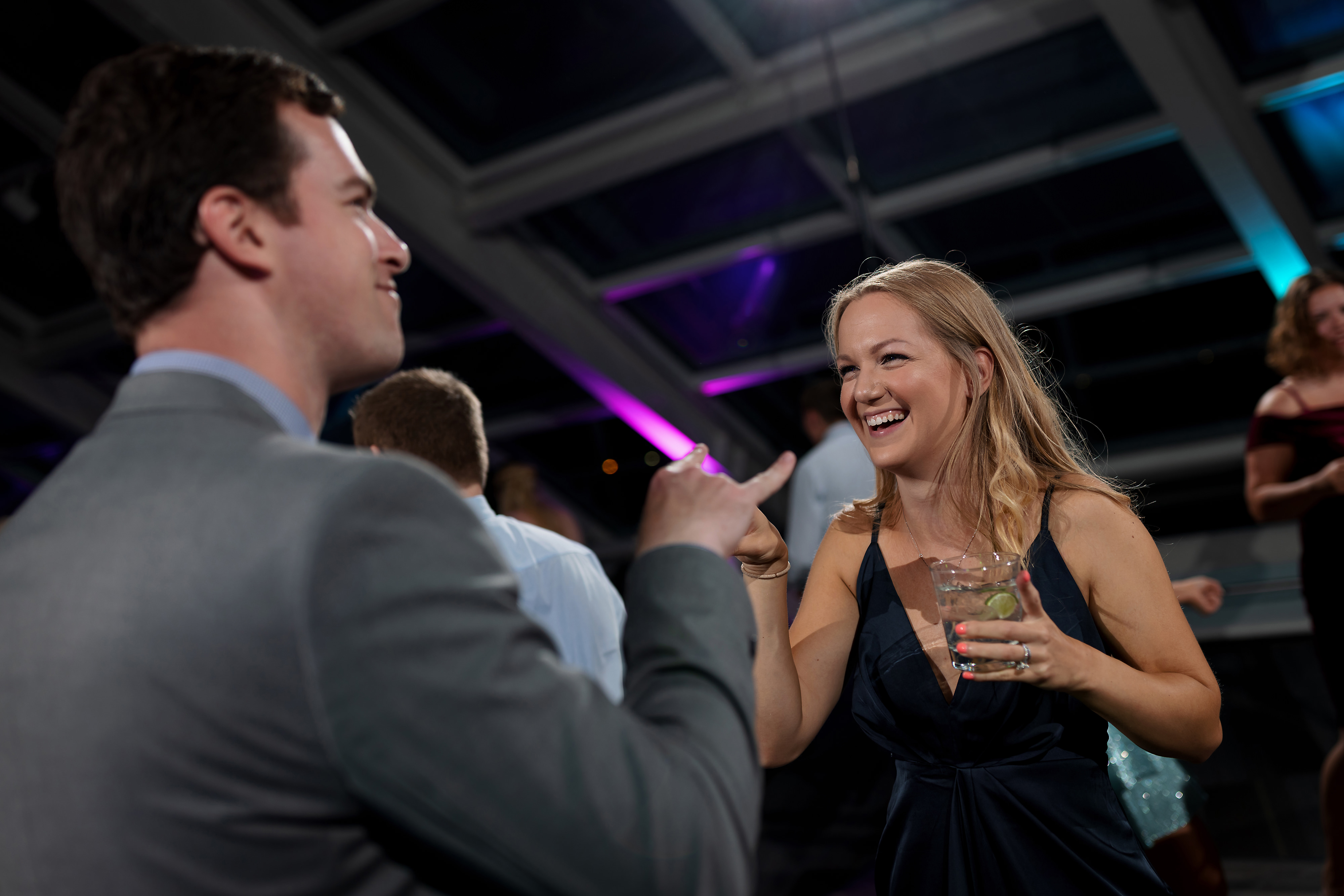 wedding guests dance during wedding reception at Adler Planetarium in Chicago