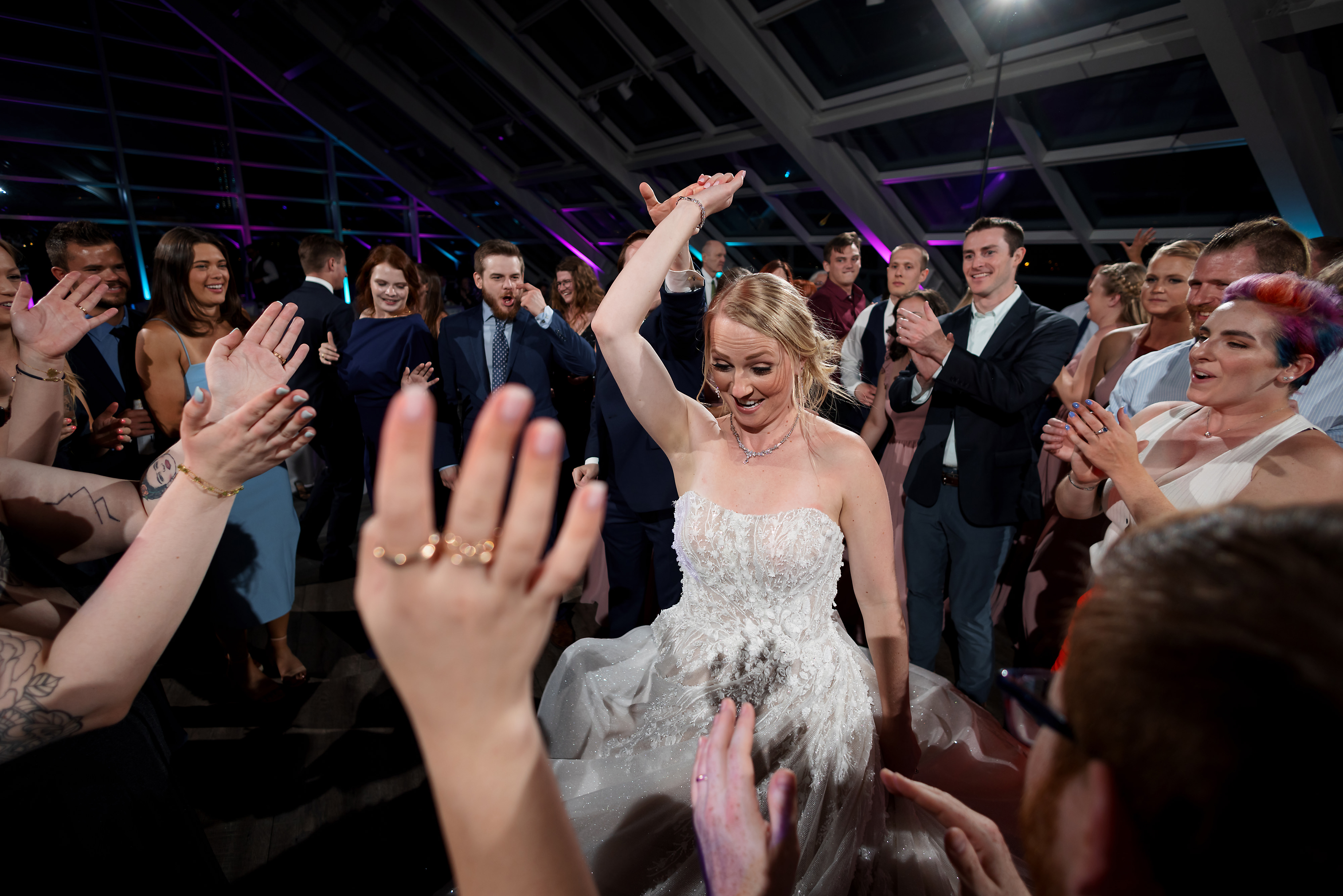 wedding guests dance during wedding reception at Adler Planetarium in Chicago