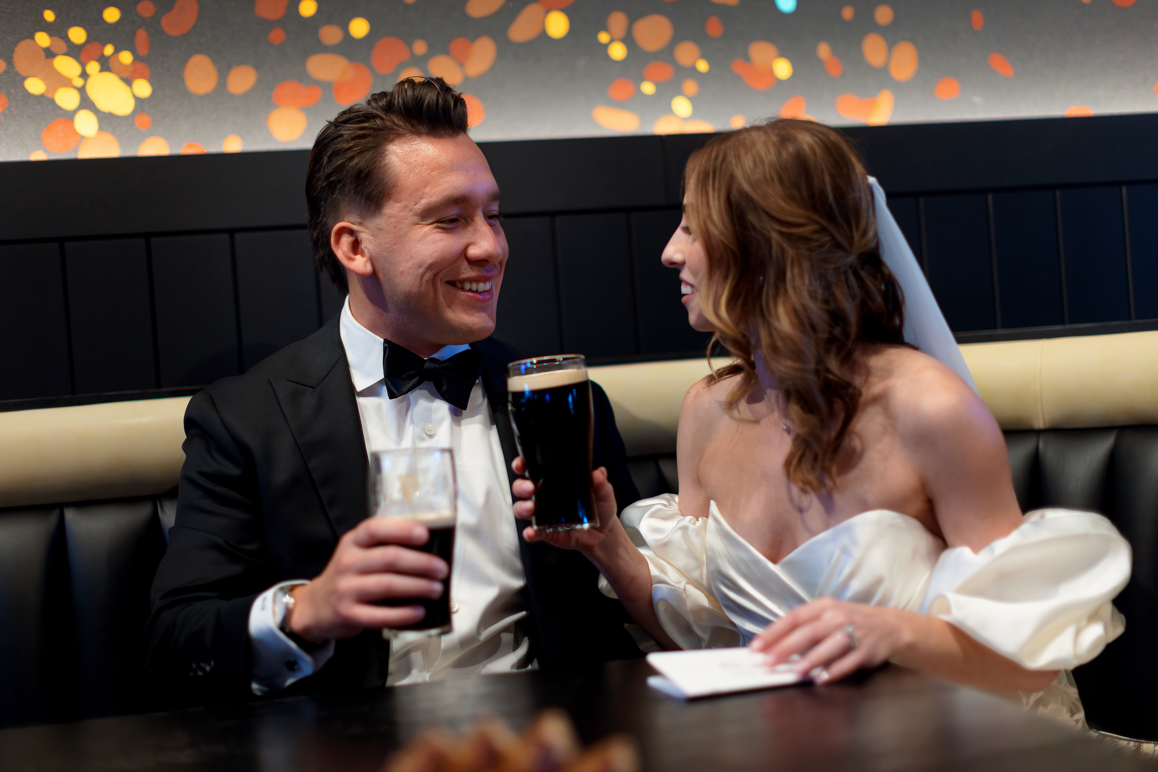 Bride and Groom share vows on their wedding day in booth at Guiness Open Gate Brewery in Chicago's West Loop