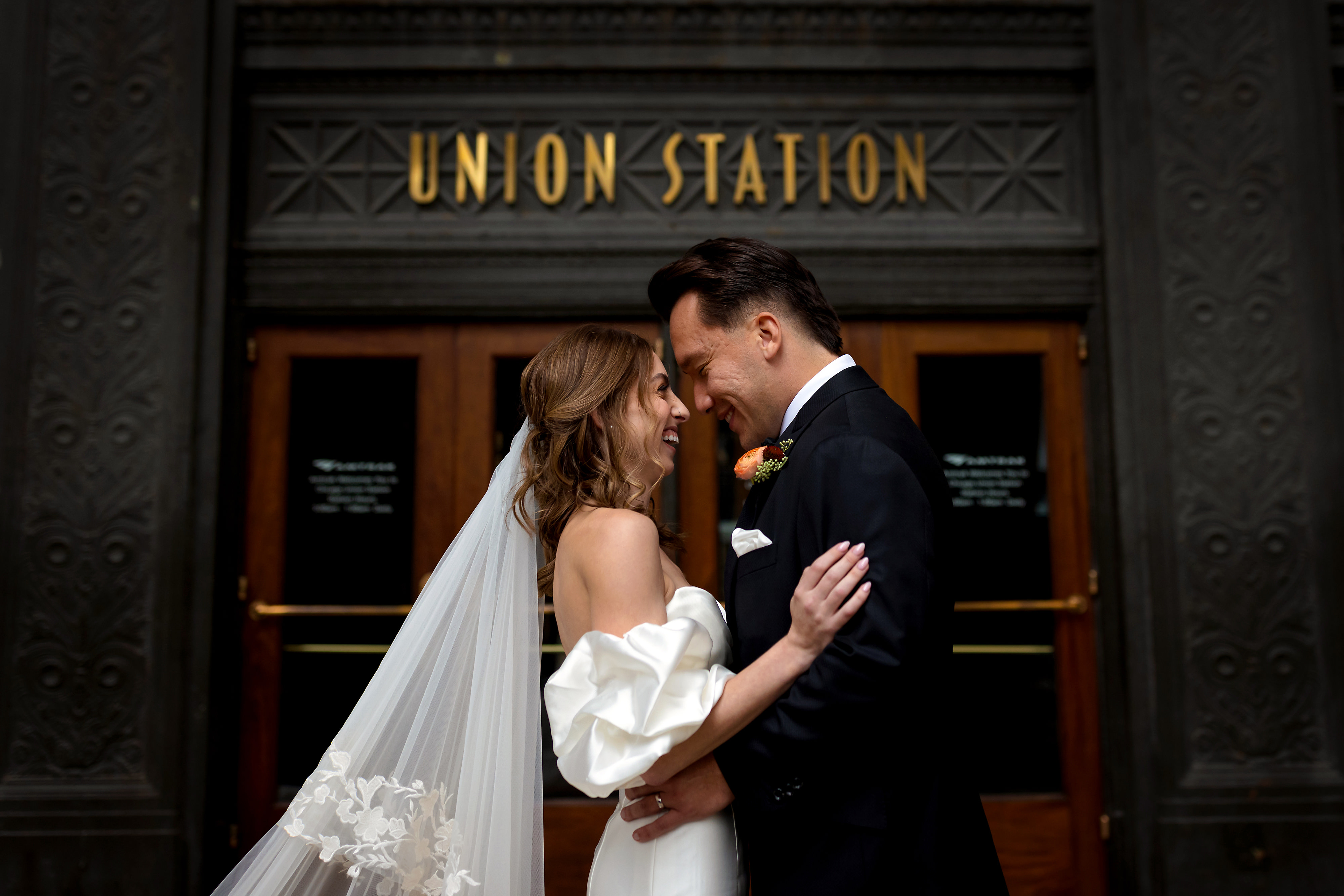 Portrait of bride and groom outside of Union Station in Chicago
