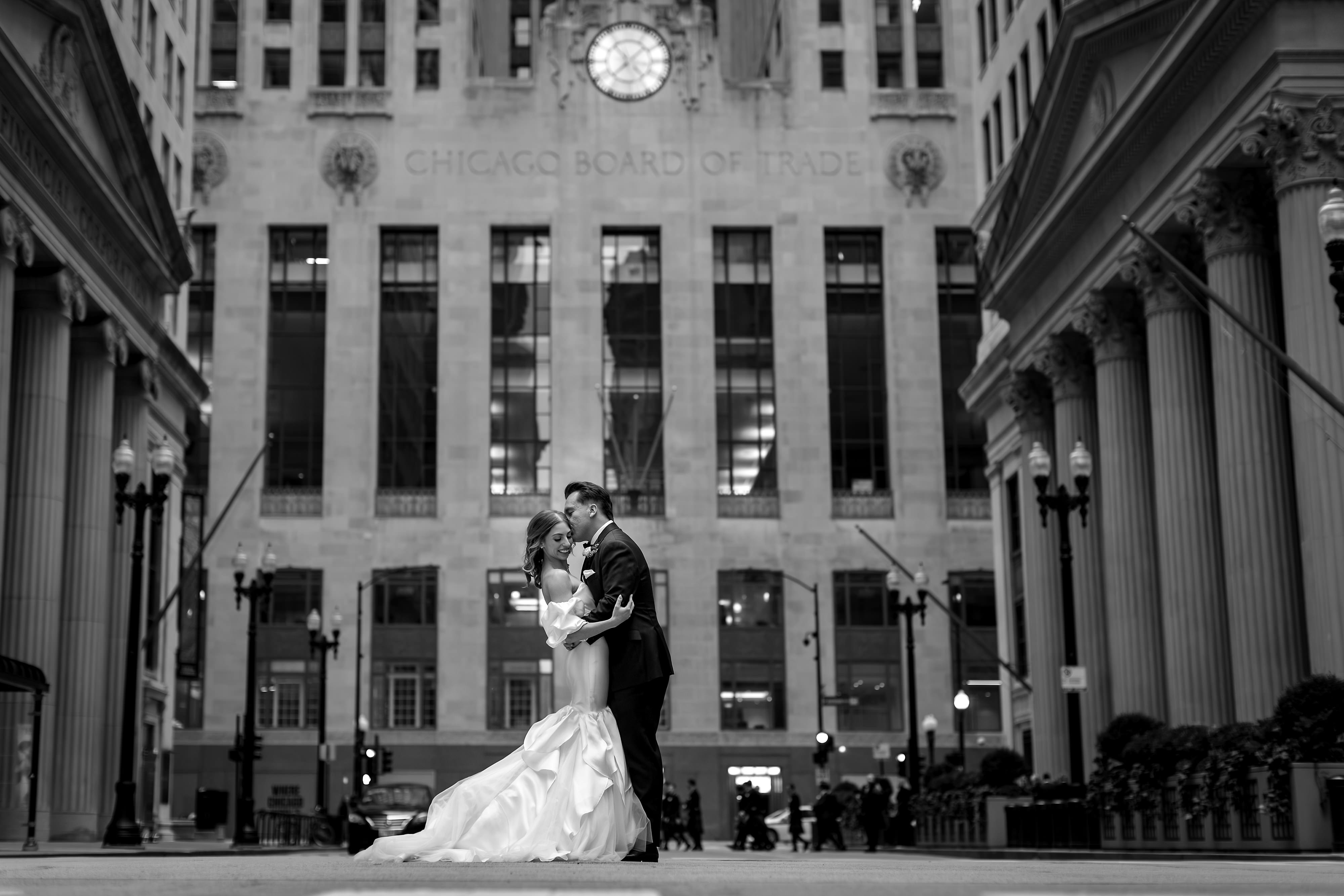 Black and White Portrait of Bride and Groom in front of Board of Trade Building on LaSalle Street in Chicago