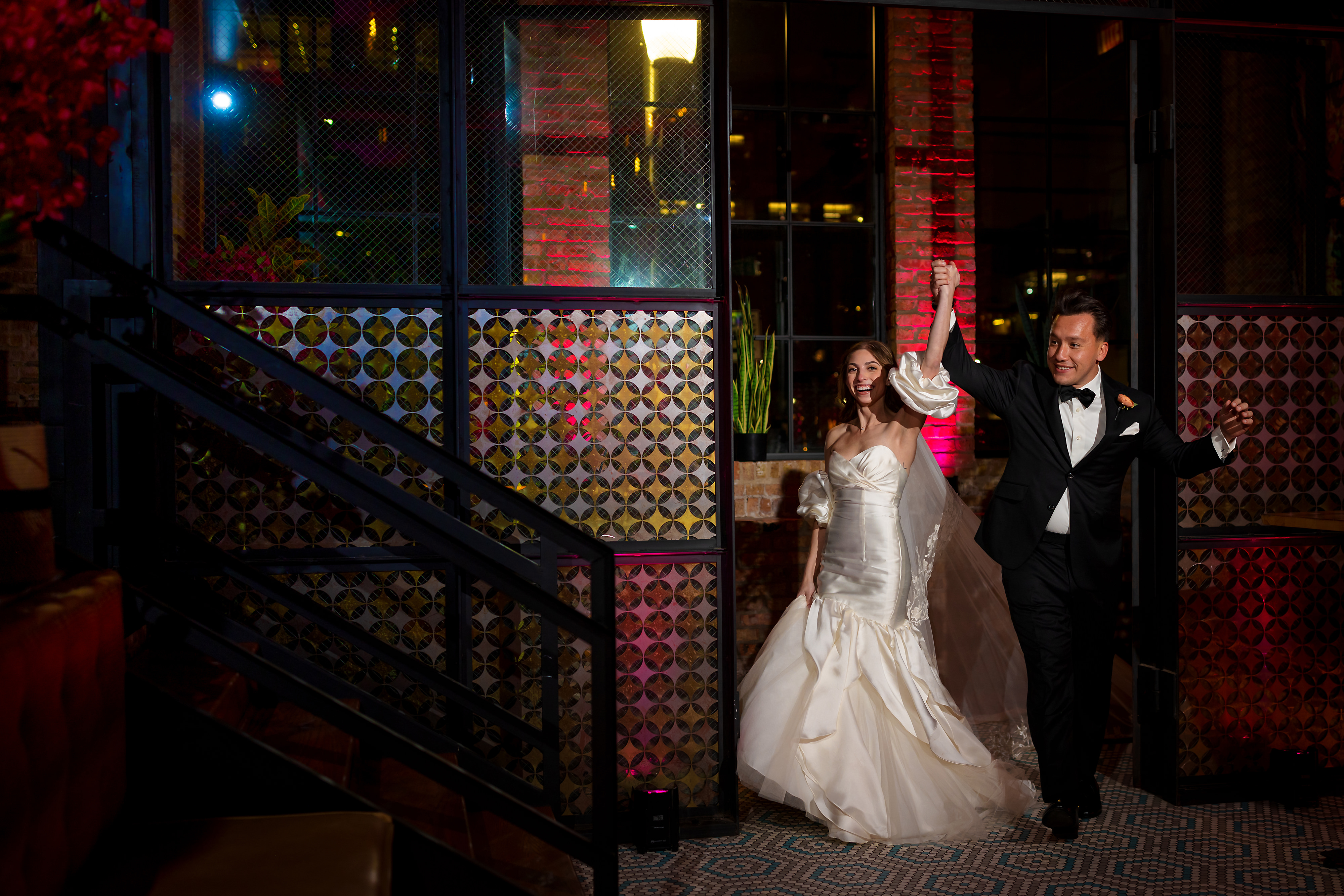Bride and Groom walk into wedding reception at Tabu Restaurant in Chicago's West Loop