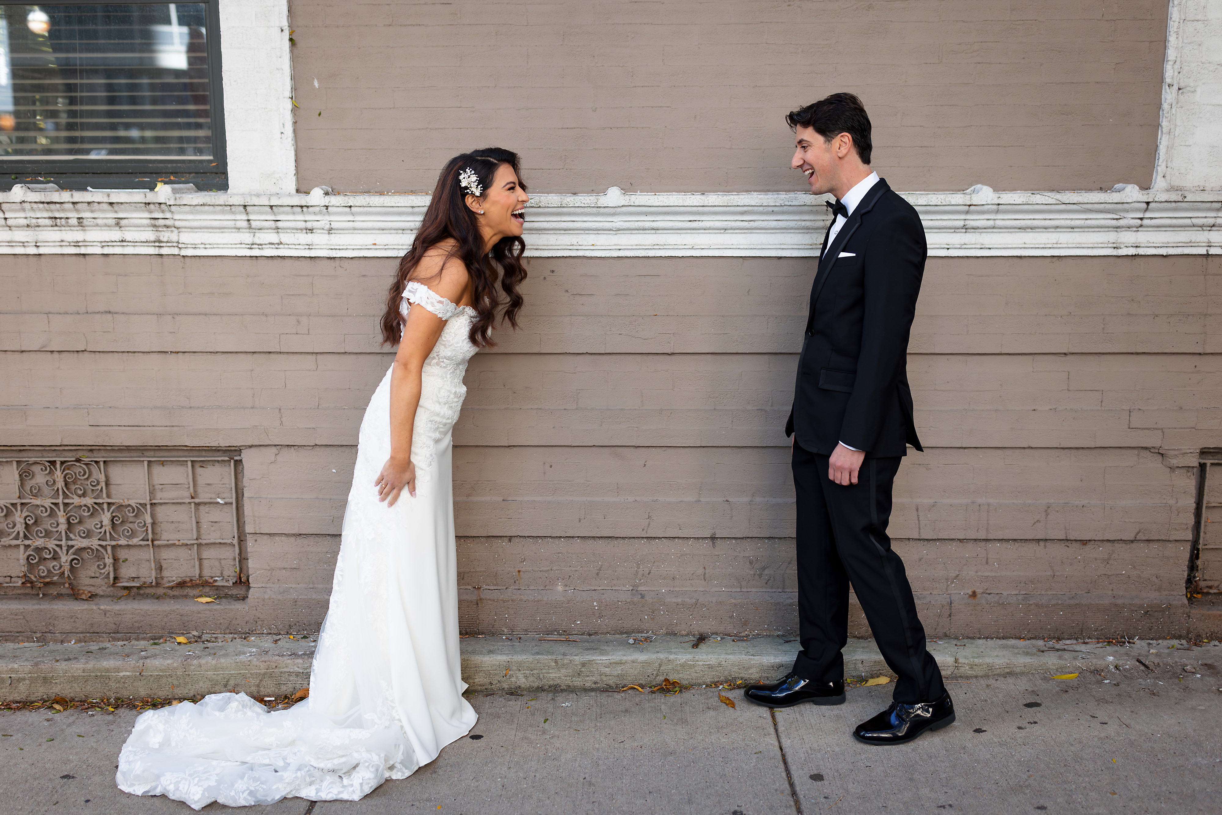 Bride and groom react during first look before their wedding in Chicago