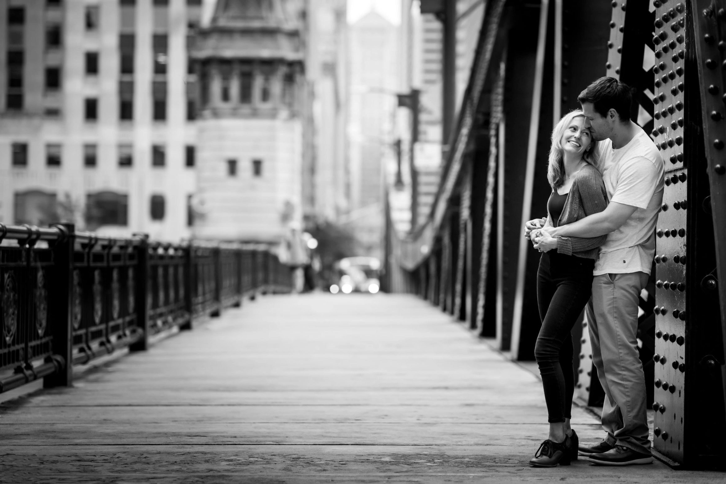 black and white photo of couple on LaSalle Street Bridge
