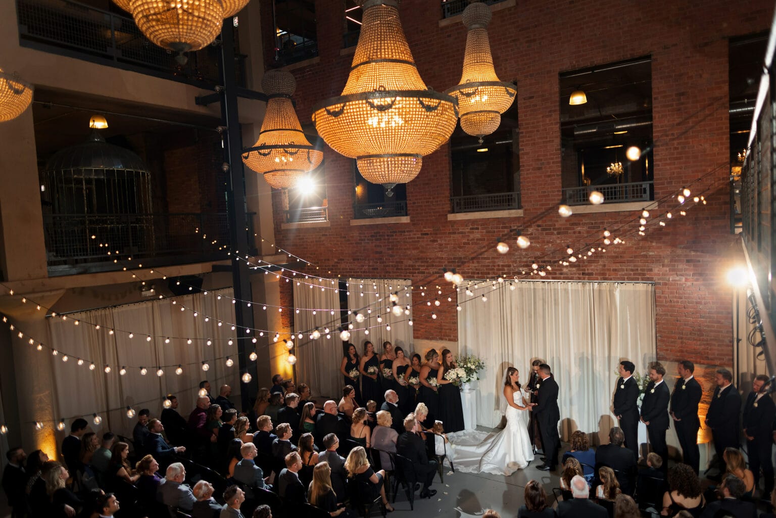 Wide angle view of North Atrium ceremony space during wedding ceremony at Artifact Events in Chicago’s Ravenswood neighborhood.